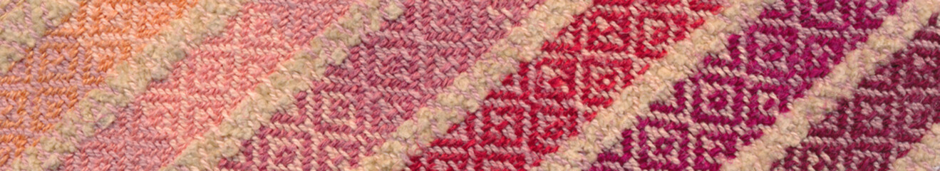 Part of handwoven striped towel in warm colors