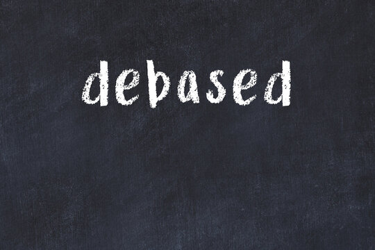 Black chalkboard with inscription debased on in