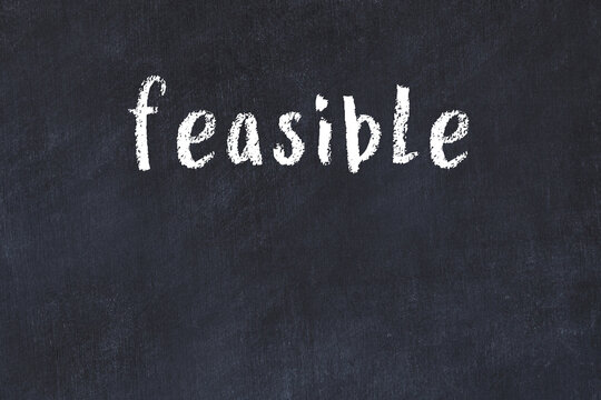 College chalk desk with the word feasible written on in