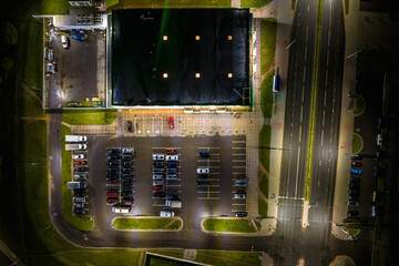 aerial night view on large open air parking lot for cars for residents of area © hiv360