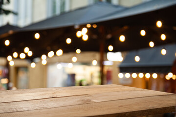 empty vintage table in front of abstract blurred cafe restaurant background, table space is empty, for your product.blurred lights