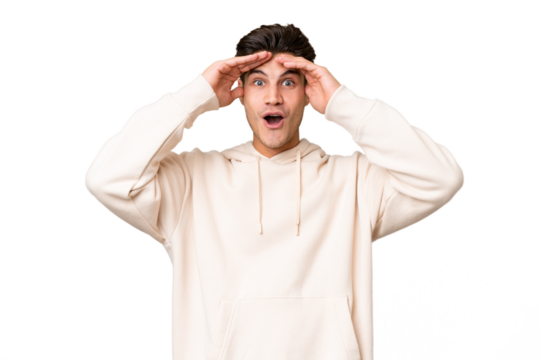 Young caucasian handsome man over isolated background with surprise expression