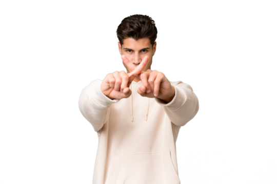 Young caucasian handsome man over isolated background making stop gesture with her hand to stop an act