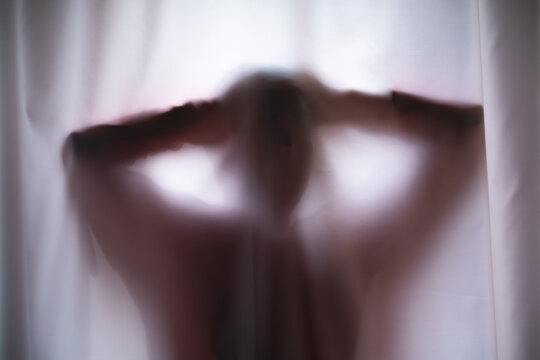 Depressed Man with mantal problems hiding above the curtain.