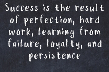 Black chalkboard with wise inscription on it