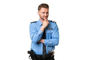 Young police man over isolated background looking to the side