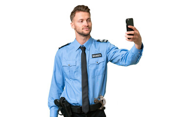 Young police man over isolated background making a selfie
