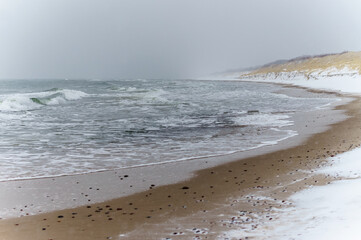 Tides and storms at sea. Snow and inclement weather at sea. Waves on the Baltic Sea.