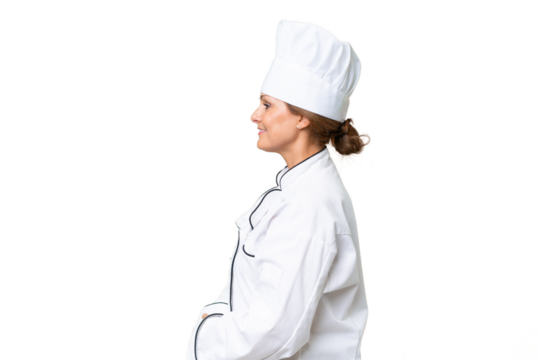 Middle-aged chef woman over isolated background in lateral position