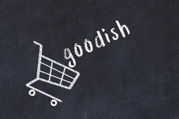 Chalk drawing of shopping cart and word goodish on black chalboard. Concept of globalization and mass consuming