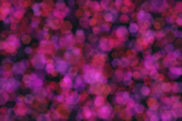 Purple and red hexagon defocused spots. Abstract bokeh background