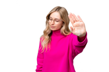 Young English woman over isolated background making stop gesture and disappointed