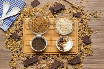 Healthy homemade chocolate muesli in a bowl and ingredients
