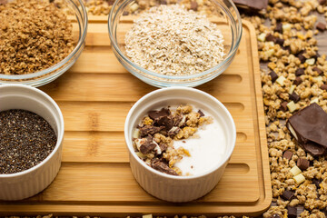 Healthy homemade chocolate muesli in a bowl and ingredients