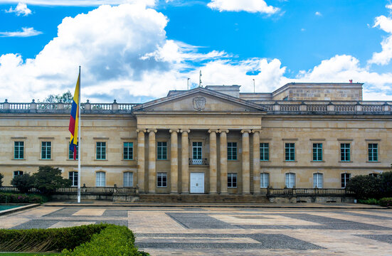 Casa de Nar&ntilde;o, colombian presidential residence in the center of Bogota, blue sky, gardens and national flag on the side. House of the president Gustavo Petro 