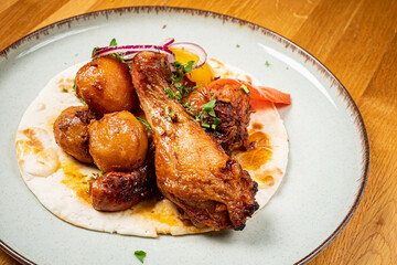 chicken with baked potato and vegetables