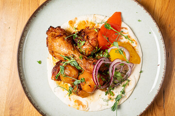 chicken with baked potato and vegetables