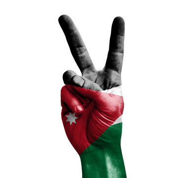 Hand making the V victory sign with flag of jordan