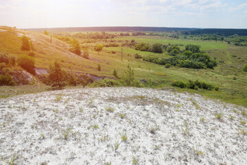 Ancient multimillion chalk mountains on the steppe surface of earth