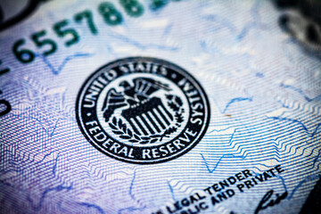 Symbol of the US Federal Reserve System on the US 50 dollar bill. Fed emblem close-up on american currency.