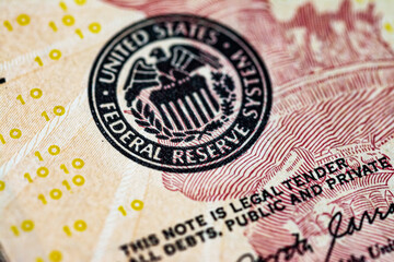 Symbol of the US Federal Reserve System on the US 10 dollar bill. Fed emblem close-up on american currency. - 548080647