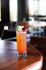Strawberry cucumber refreshing cocktail on wooden bar