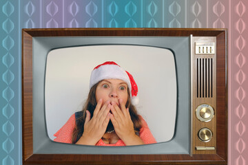 old retro analog TV 60s with woman in santa claus red hat with long hair, having fun, festive mood,...