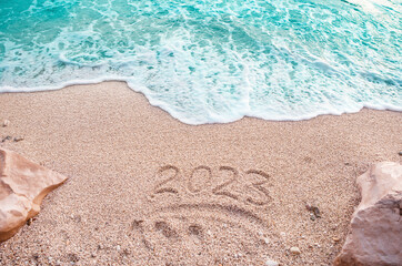 Fototapeta na wymiar Beach in Montenegro inscription in numbers 2023