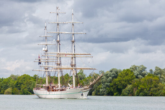 MESNIL-SOUS-JUMIEGES, NORMANDY, FRANCE: Armada 2019 Grande Parade, tall ship Shabab Oman II sailing on the Seine River, through lush and green countryside