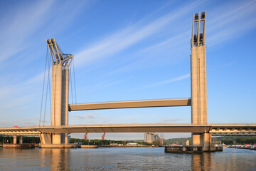 Fototapeta premium ROUEN, NORMANDY, FRANCE: Gustave Flaubert Bridge under warm morning light, one side of the roadbridge is lifted up