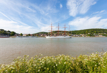 HEURTEAUVILLE, NORMANDY, FRANCE: Armada 2019, russian tall ship Sedov sails from Rouen to the English Channel, on the Seine River, in front of Caudebec-en-Caux