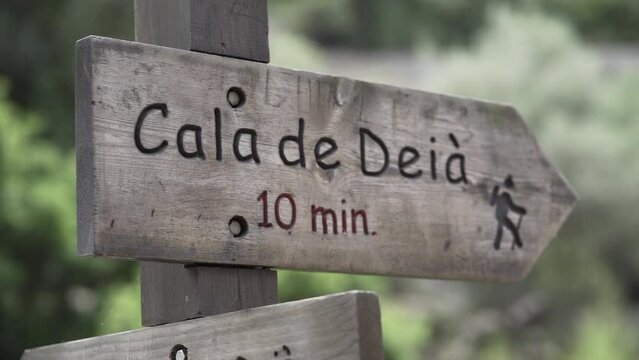 Slow motion video of a rustic wooden sign written in catalan language