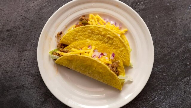 Rotating Plate of Beef Tacos with Cheese
