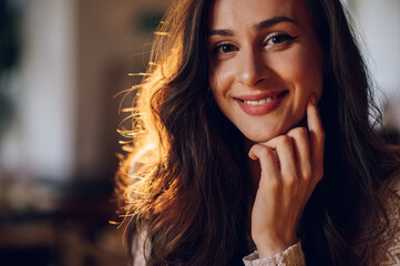 Portrait of beautiful young woman posing in a cafe
