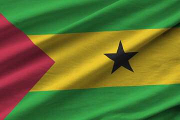 Sao Tome and Principe flag with big folds waving close up under the studio light indoors. The...