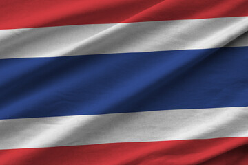 Thailand flag with big folds waving close up under the studio light indoors. The official symbols...