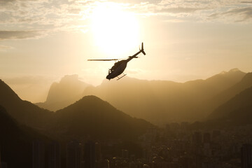 Helicopter at sunset with the mountains of Rio de Janeiro in the background