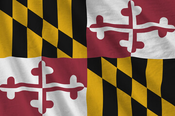 Maryland US state flag with big folds waving close up under the studio light indoors. The official...