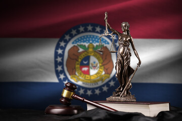 Missouri US state flag with statue of lady justice, constitution and judge hammer on black drapery....