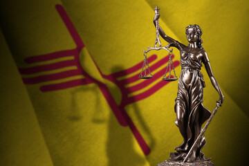 New Mexico US state flag with statue of lady justice and judicial scales in dark room. Concept of...