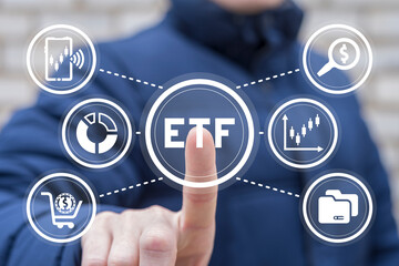 ETF Exchange Traded Funds Investment concept. Businessman using virtual touchscreen presses abbreviation: ETF.