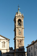 Bell tower of Saint Stephen's Basilica, church estabilished in 5th century, in Milan city center, Lombardia region, Italy 

