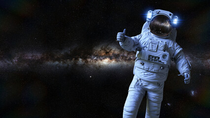 astronaut showing thumbs up sign during spacewalk © dottedyeti