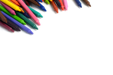 Crayons lined up isolated on white background.