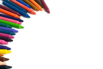 Crayons lined up isolated on white background.