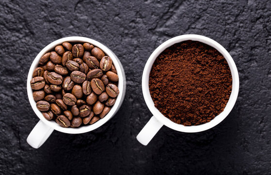 Roasted coffee beans and ground coffee, on dark background, closeup image, space for text