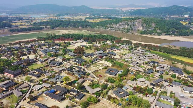 Drone view, Aerial video of Andong Hahoe Folk Village in Autumn South Korea, A village surrounded by a river.