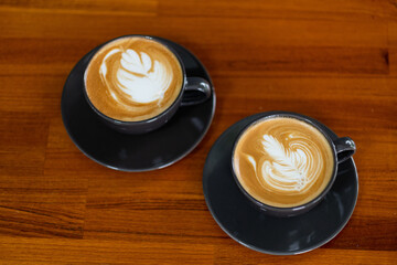 hot latte art coffee on wood table, relax time