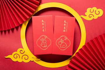 Chinese New Year of Rabbit red pockets with traditional Chinese decorations at horizontal composition translations of the Chinese words are good luck for the new year no logo no trademark