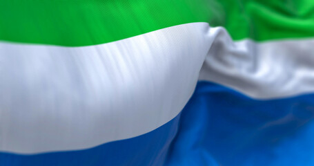 Detail of the Sierra Leone national flag waving in the wind